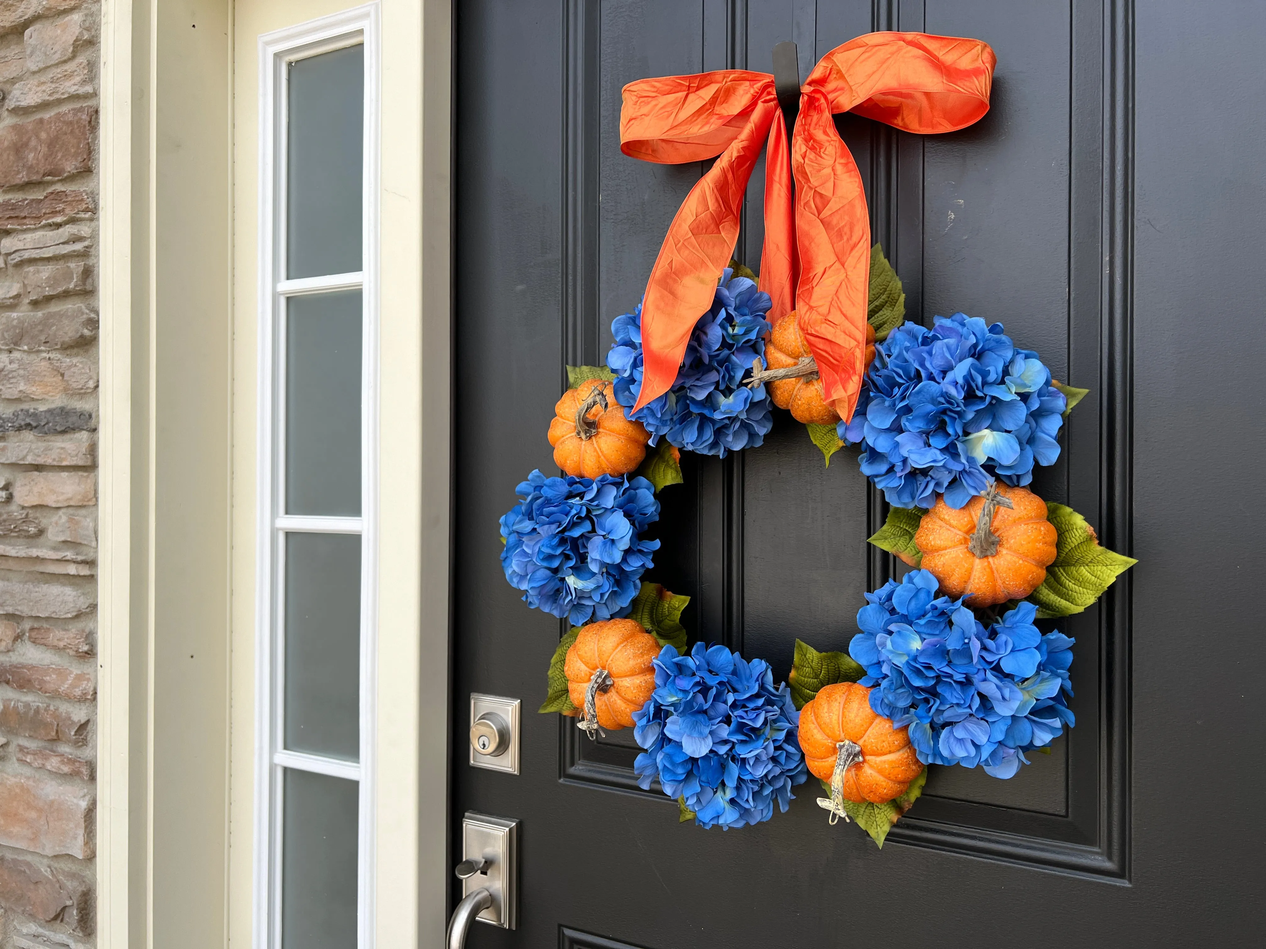 Vibrant Orange Pumpkin and Blue Hydrangea Wreath